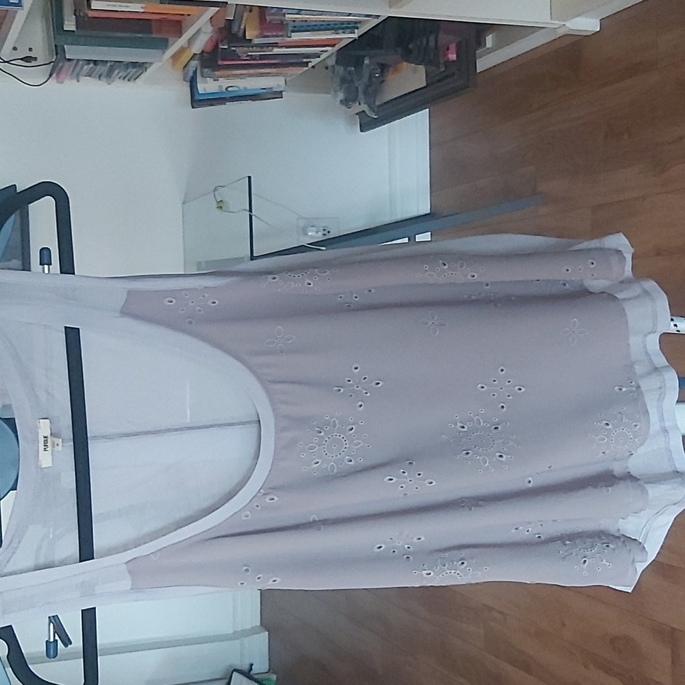 Pursue Anthropologie top in a grey and mauve tone.